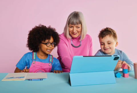 Woman on tablet with children